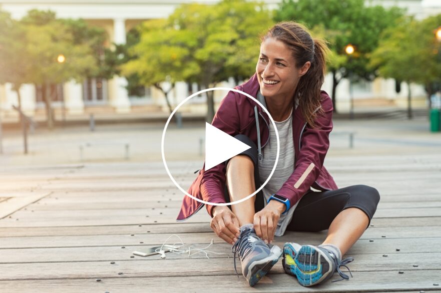 Female sport fitness runner getting ready for jogging outdoors in spring.